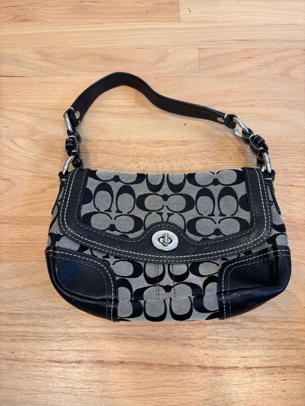Vintage Coach signature canvas shoulder bag featuring black leather trim